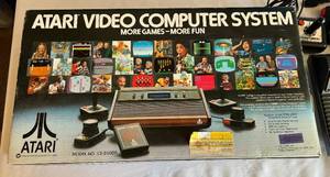 lot 50 image: Vintage Atari Video Computer System 1980 in Original Box includes console, paddles, 2 joysticks, and cords
