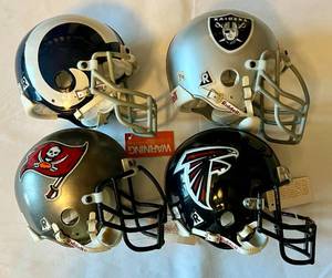 lot 81 image: 4 Mini Football Helmets - Oakland Raiders, Tampa Bay Buccaneers, Atlanta Falcons, St. Louis Rams