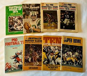 lot 100 image: (8) 1970s Vintage Sports Books - Joe Namath, 1976 Football Stars, 1977 Basketball Stars, 1974 Football Stars, Super Bowl, and More