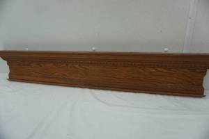 lot 89 image: Wood mantle, 41.5 with hangers on back