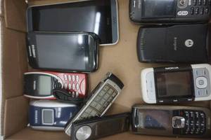 lot 147 image: Used phone lot with misc. cords