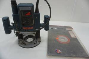 lot 148 image: Bosch router and base plate RM 3509