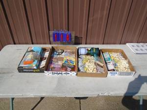 Qty of 4 flats of books & golf tees. As shown.