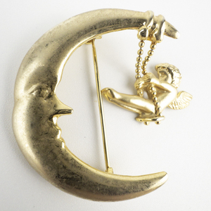 lot 154 image: Danecraft Cherub Swinging From Crescent Moon Gold Plated Base Metal Brooch .