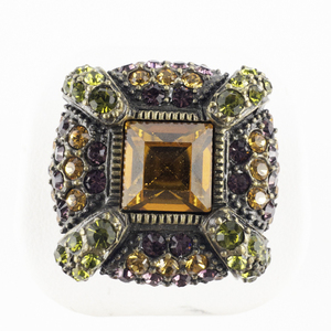 lot 212 image: Heidi Daus Green, Orange, & Purple Crystal Square Base Metal Cocktail Ring. Size 9.5 - 9.75.