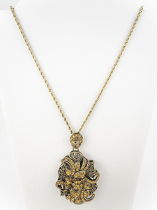 lot 263 image: Butler Orange Rhinestone Filigree Gold Tone Base Metal Pendant Necklace .