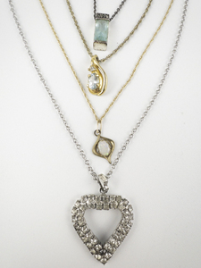 lot 299 image: Group of 4  Cute Base Metal Pendant Necklaces.