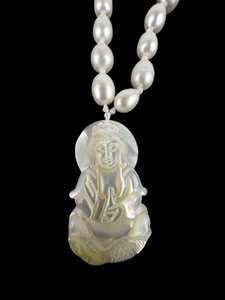 lot 206 image: White Cultured Freshwater Pearl With Mother Of Pearl Carver Guanyan Sterling Silver Pearl Pendant Necklace.