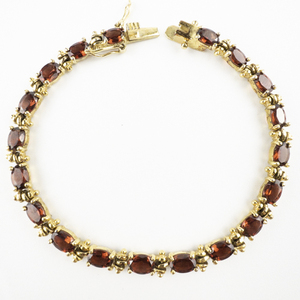lot 102 image: Jasco Designs Garnet  Vermeil Tennis Bracelet.