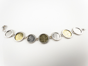 lot 104 image: MILOR Two-Tone Lire Coin Sterling Silver Link Bracelet.