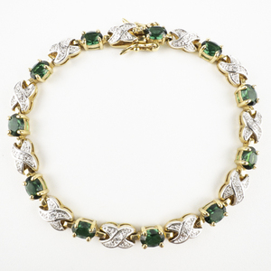 lot 111 image: Green Synthetic Emerald-Color Stone & Cross Yellow Base Metal Tennis Bracelet.