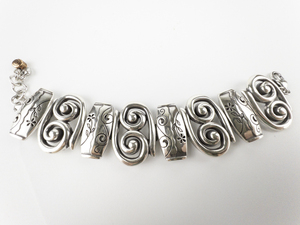 lot 112 image: Brighton  PabloS Passion Swirls & Floral Base Metal Panel Bracelet.