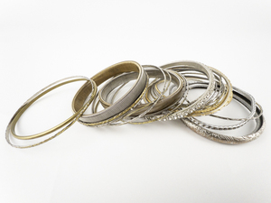 lot 124 image: Two Dozen Rose, Yellow, & White Base Metal Bangles.