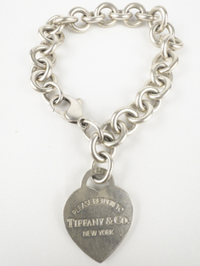 lot 13 image: Tiffany & Co. Please Return To Tiffany & Co Heart Tag Sterling Silver Charm Bracelet.