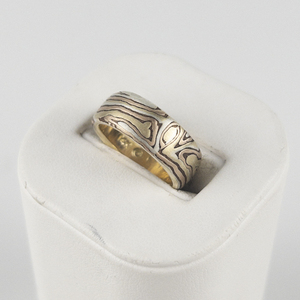 lot 2 image: George Sawyer  Mokume Gane Handbuilt Flat Band Yellow, Red And Gray 14K Gold With Etched Copper. 