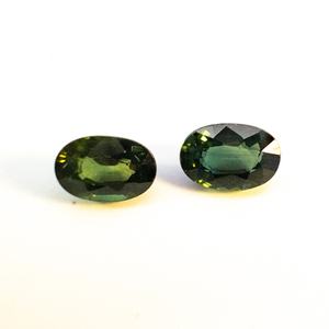 lot 78 image: Pair of NATURAL GREEN SAPPHIRES1010 - 1.1ct. Oval brilliant cut