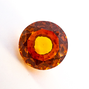 lot 95 image: LAB GROWN ORANGE SAPPHIRE - 4.91ct. Round Mixed Cut