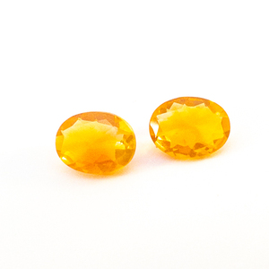 lot 100 image: Pair of FIRE OPAL - 1.54ct. Oval brilliant cut