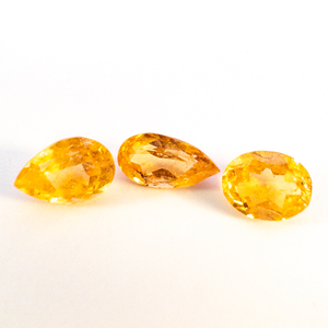 lot 339 image: Group of three GOLDEN SPHALERITE - 2.09ct (total) - 2x Pear & Oval