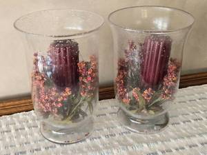 lot 39 image: Lot of 2 Clear Vases with Red Candles in Them