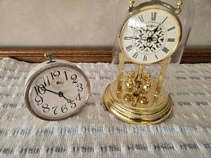 lot 59 image: Howard Miller Anniversary Clock (plastic top), Westclox Alarm Clock