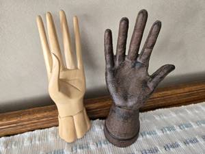 lot 72 image: One Wooden Hand, One Metal Like for Holding Rings Possibly