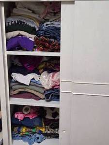 lot 431 image: Cabinet Full of T Shirts and Other Clothes - Cabinet Not Included