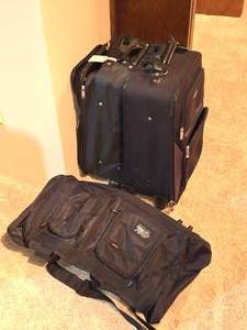 lot 484 image: Lot of Two Black Rolling Suitcases and One Duffel Bag