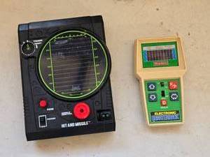 lot 549 image: Lot of Coleco Electronic Quarterback and Hit And Missile Handheld Games