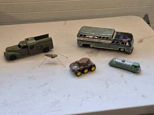 lot 561 image: Lot of Vintage Toy Vehicles including Greyhound Bus, Bell Telephone Truck, and More