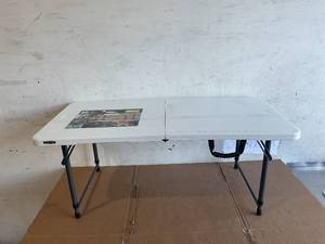 lot 197 image: Lifetime 4-Foot Adjustable Fold-In-Half Table