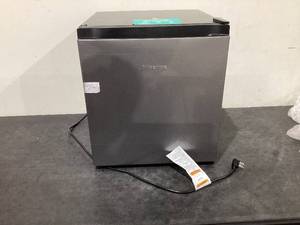lot 553 image: Hisense 1.6 cu. ft. Compact Refrigerator Silver, Standard 17.5 Width, 1 Year Warranty, Energy Star Certified, Low Noise, WMS017M6XVE