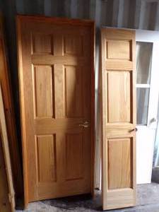 lot 100 image: 32 Wood door with 32 Bifold Door