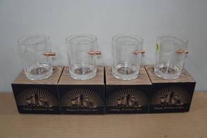 lot 99 image: 4 Lucky Shot Rocks Glasses with Embedded Bullets -4 Designs