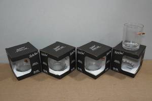 lot 101 image: 4 Lucky Shot Rocks Glasses with Embedded Bullets