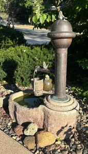 lot 13 image: Stone and Metal Bucket Pouring Water Fountain