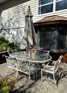 lot 6 image: Glass Top Patio Table with Six Chairs and Umbrella