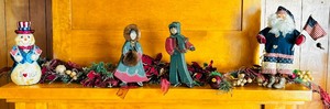 lot 170 image: Mantle Ideas for the Holiday Including Garland, Santa USA, Snowman USA and Man and Woman