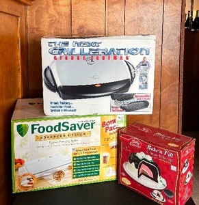 lot 94 image: Three New Kitchen Helpers, Including a Food Saver, Bake and Fill and George Foreman Grill