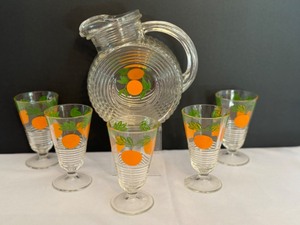 lot 46 image: Vintage Tilt Disc Glass Juice Pitcher and Coordinating Footed Juice Glasses