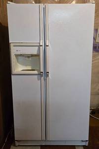 lot 207 image: White General Electric Side by Side Refrigerator Freezer