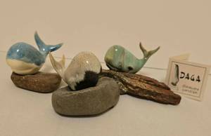 lot 263 image: Three Maigon Daga Whale Sculptures