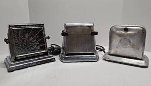 lot 311 image: Three Vintage Drop Side Toasters