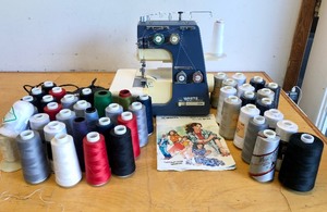 lot 394 image: Working WHITE Sewing Machine Model 534W-H wMany Thread Spools