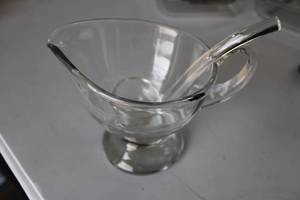 lot 11 image: Lot of Kitchen Items Ambrosia Gravy Boat, Pyrex Dishes, Ninja Accessories, Silverplated Trivet