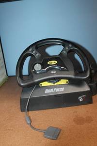 lot 35 image: Mad Catz Dual Force Racing Wheel with Pedals