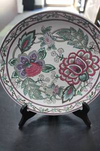 lot 80 image: Assorted Decorative Items Lot Including Flowered Plate, Rag Doll Tea Set, and Canoe Model