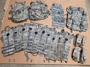 lot 11 image: 2 3-day Assault Packs (no tears), 6 Molle II Triple Magazine Pouches, 4 Waist Packs (excellent condition), 10 Hydration pouches, and 2 Blackhawk S.T.R.I.KE. Gen IV Double Magazine Pouches (each holds 6 mags)
