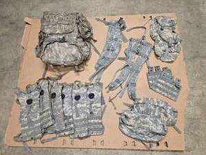 lot 20 image: One Fully-Assembled ruck sack (includes frame, waist belt, should harness and 2 side sustainment pouches) and 2 additional sustainment pouches, an additional shoulder harness and waistbelt, & 6 hydration pouches