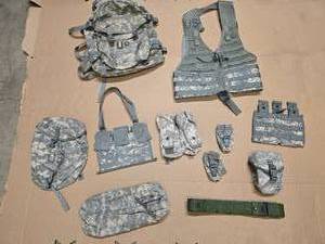 lot 22 image: 1 3-day assault pack, 1 Military load carrier vest, 1 sustainment pouch, 1 6 Mag Bandoleer, 1 waist pack, 1 Blackhawk S.T.R.I.K.E double mag pouch, 2 Flash Bang Pouches, 1 Individual First Aid Kit Pouch (IFAK), 1 OD equipment belt, and 1 Triple Mag Pouch